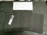 a keyboard and a mouse on a desk with a mouse pad