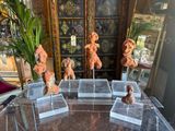 a table that has a bunch of figurines on it