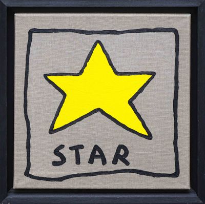 framed picture of a yellow star on a gray background