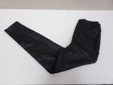 a pair of black pants sitting on a white table