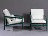 pair of green and white lounge chairs with white cushions on a grey background