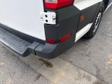 a white truck parked on the side of the road