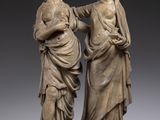 paire de statues en marbre représentant une femme et un homme