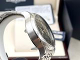 a watch that is sitting on a stand in front of a box