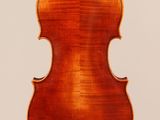 an antique violin with a wooden back and a long neck