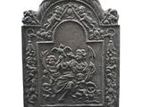 an antique cast iron plaque depicting the virgin and child jesus