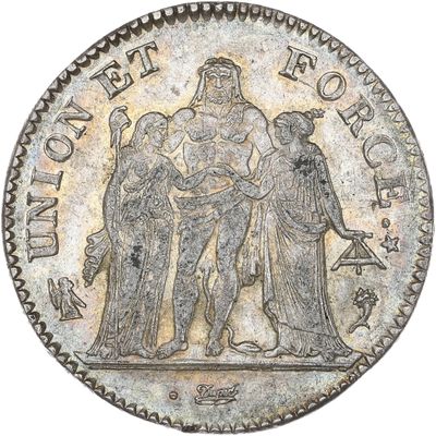 une pièce de monnaie en argent portant l'image d'un homme et d'une femme
