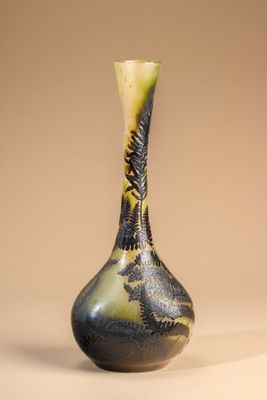 a black and yellow vase sitting on a table