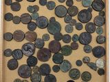 an image of a box filled with lots of coins on top of a table