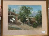 someone is holding a picture of a small house in a frame