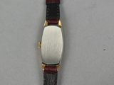 an image of a close up of a wrist watch on a table