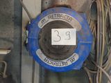 a blue fire hydrant with a sign on the side of it