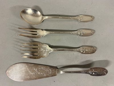 five spoons and a fork sitting on a table