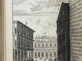 an open book with a picture of a building in the background