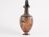 a vase with a painting on it on a white surface