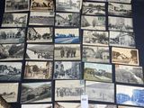 an image of a bunch of old postcards sitting on top of a table