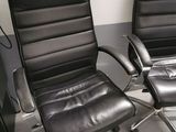 two black leather office chairs in a room