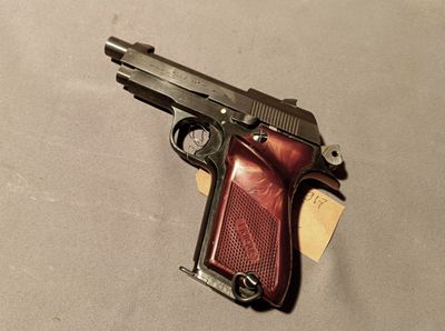 a gun that is laying on a table