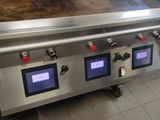 an image of a commercial kitchen stove with four burners