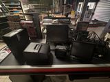 a lot of electronics on the counter in the store