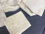 a pair of scissors and a pair of cloths on a table
