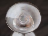 a close up of a glass of wine on a table