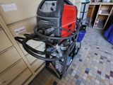 an image of a welding machine in a garage