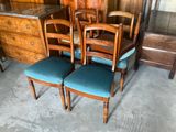 four chairs that are sitting next to each other