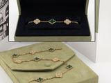 an image of a box containing a necklace, bracelet, and ring