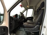 a white van with a black seat in the back of it