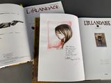 a book with a drawing of a woman holding a gun