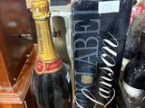 a bottle of wine and a box of wine on a table