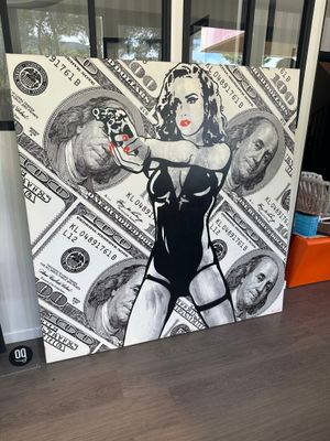 une photo d'un tableau représentant une femme avec de l'argent dessus