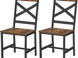a pair of wooden chairs sitting next to each other on a white background