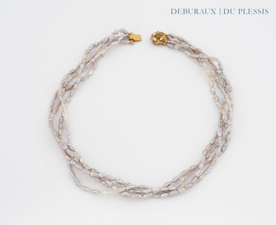 necklace made of glass beads with a gold clasp on a white background