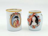 two cups that have pictures of people on them