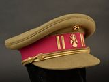 a hat that has a red ribbon on it