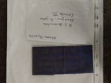 a piece of paper that has a blue label on it