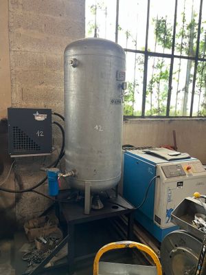 a machine that is sitting next to a tank in a room