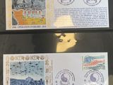 two stamps with a picture of elephants on them are on a table