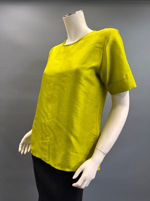 an image of a mannequin wearing a yellow shirt and black pants