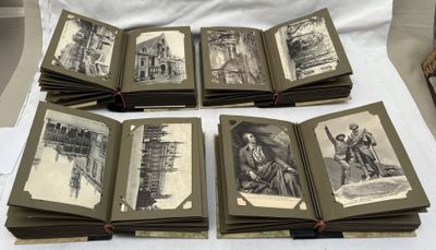 several old books with black and white pictures on them sitting on a table