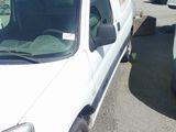 a white van that is parked in a parking lot