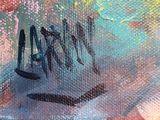 painting of a smiley face on the side of a graffiti covered wall