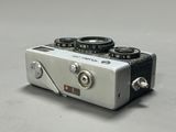a silver camera that is sitting on a table