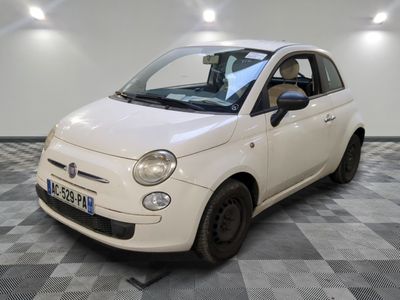 a picture of a small white car on a checkered floor