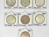six types de pièces différents sont disposés en rangée sur une surface blanche