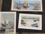 three framed pictures of boats on the water