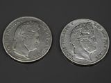 deux pièces d'argent, dont l'une représente la tête d'une femme et l'autre celle d'un homme