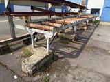 a long row of benches sitting on the side of the road